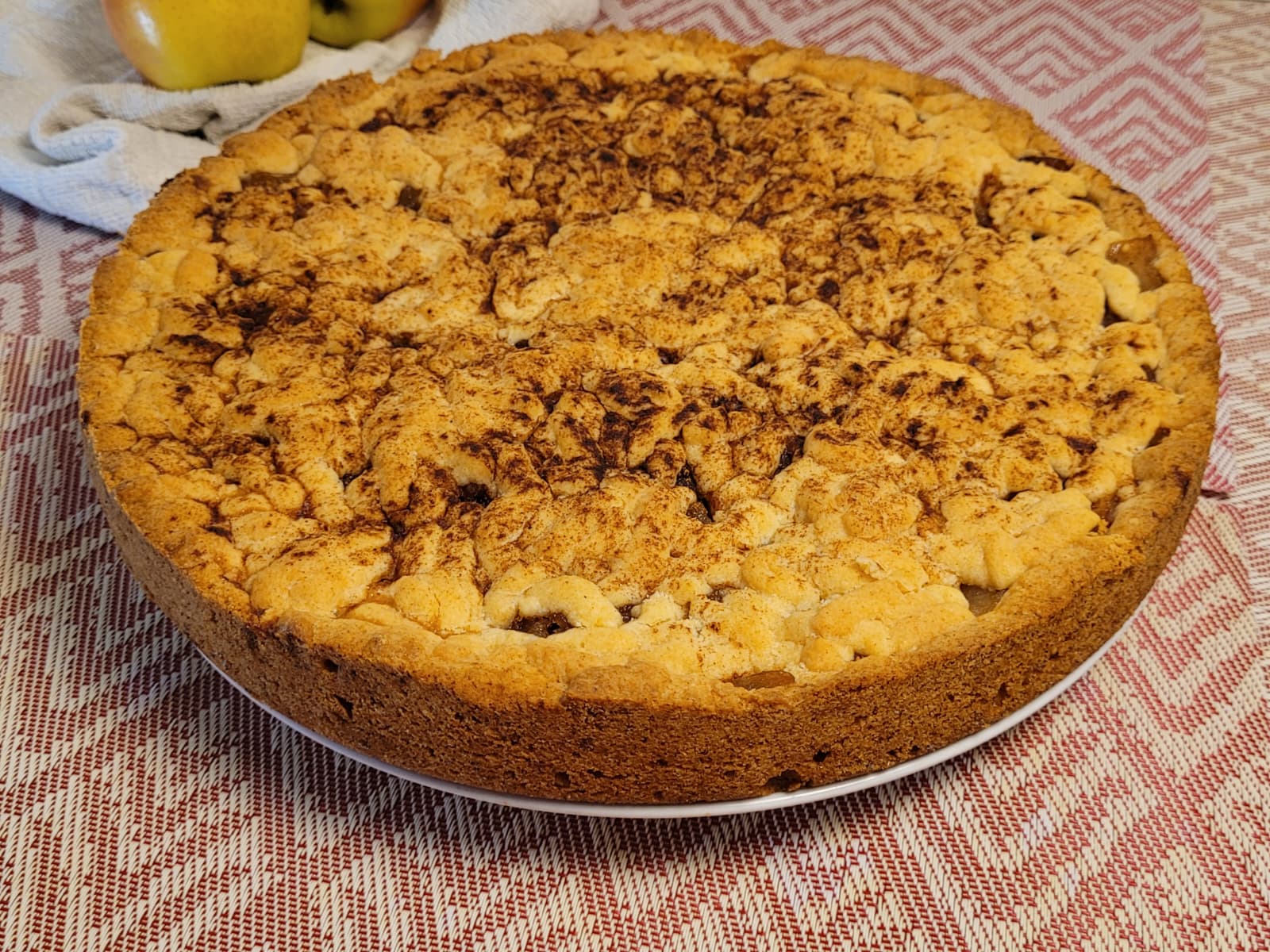 Close-up of homemade apple pie with soft apple filling and cinnamon